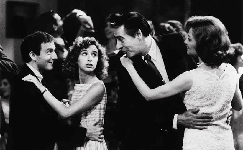 Jennifer Grey with Jerry Orbach and others dancing around a ballroom 