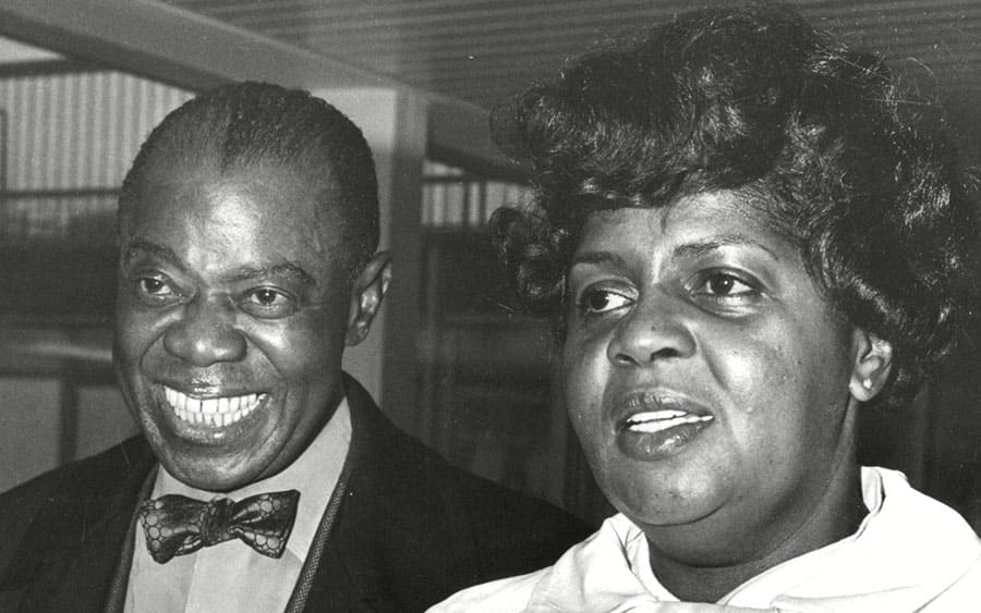 Louis Armstrong Jazz Trumpeter And Singer With His Wife Lucille Arriving At London Airport
