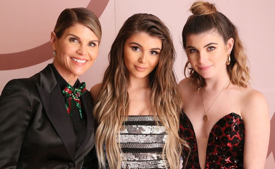 Lori Loughlin with her daughters posing on the red carpet 