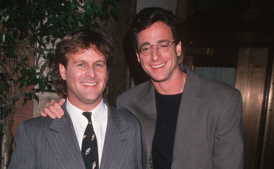 Dave Coulier and Bob Saget posing on the red carpet together 