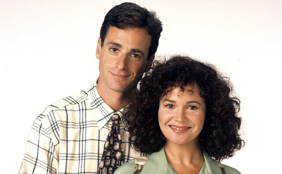 Bob Saget and Gail Edwards posing for a promotional photograph 