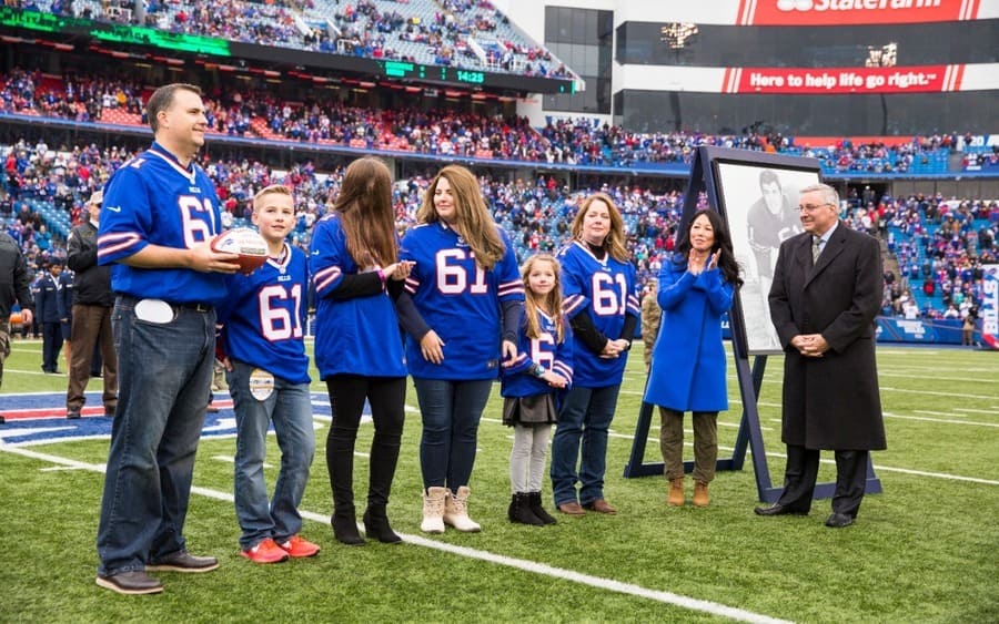  Buffalo Bills owners Kim and Terry Pegula honor the family of Buffalo Bills offensive lineman Bob Kalsu