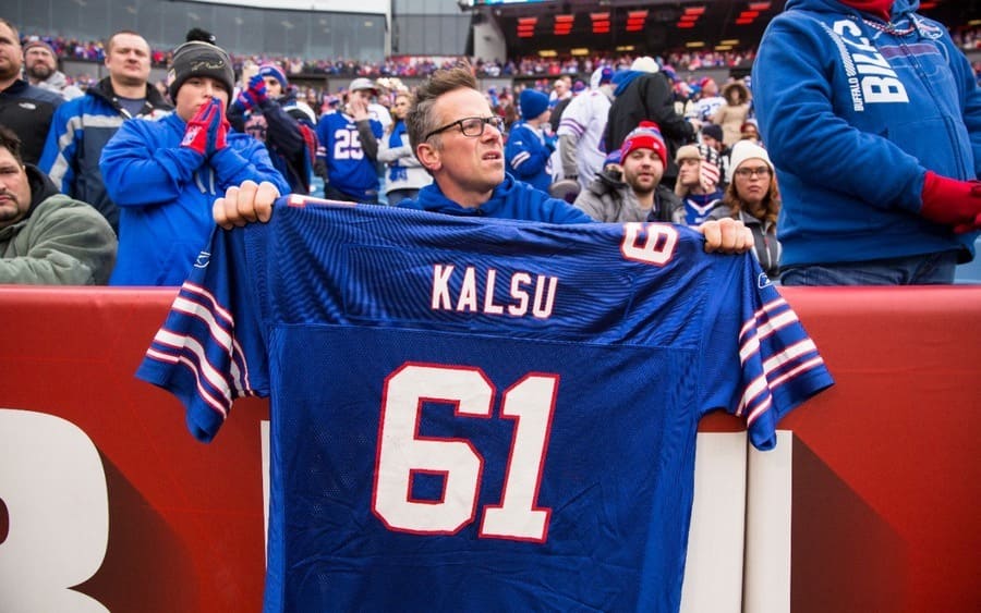 A fan holds a Buffalo Bills offensive lineman Bob Kalsu jersey 