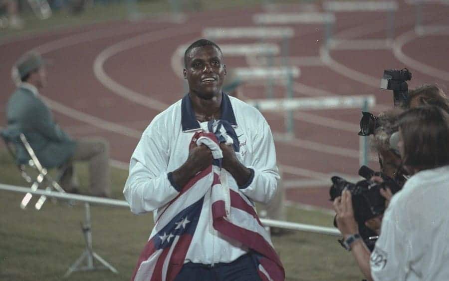 Carl Lewis Holding an American Flag