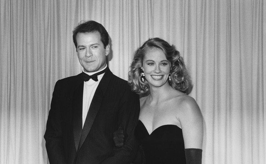 US actor Bruce Willis and US actress Cybill Shepherd, both in formal evening wear, attending the 37th annual Emmy Awards.