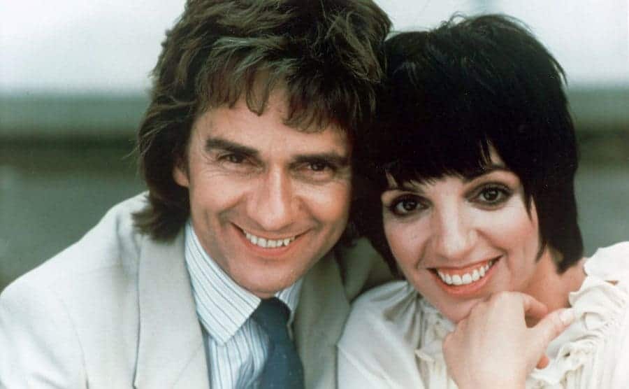 Dudley Moore and Liza Minelli posing for a photograph on the set of Arthur 