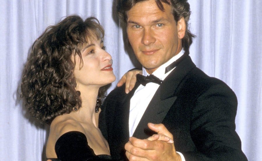 Jennifer Grey and Patrick Swayze are striking a pose as if dancing on the 60th Annual Academy Awards.