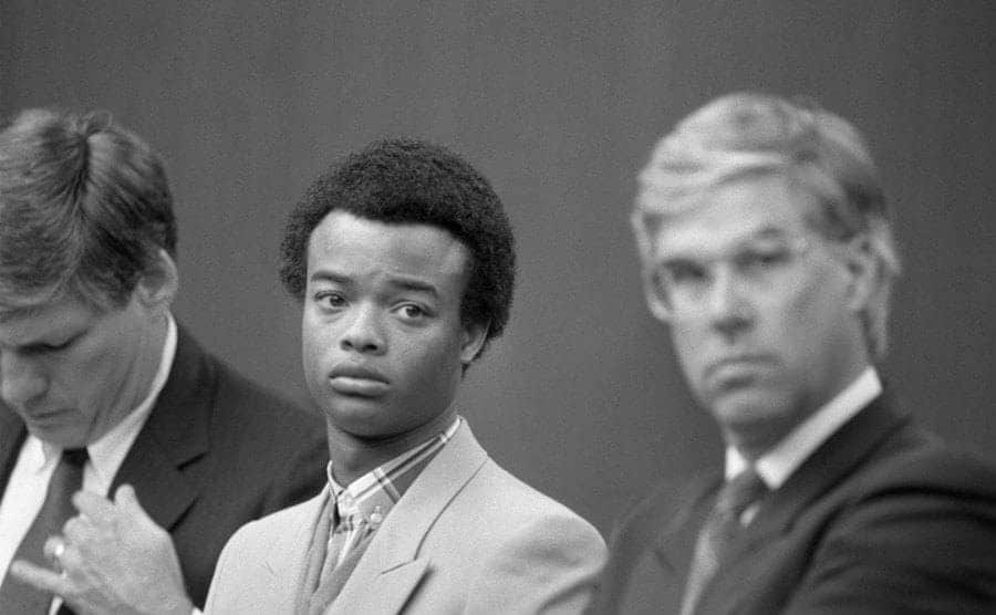 Todd Bridges sitting in court in between his lawyers. 