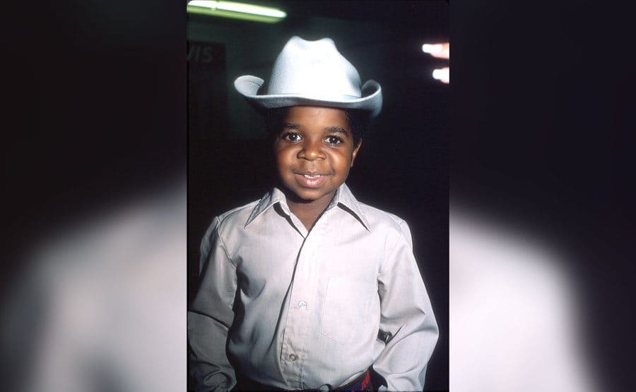Gary Coleman poses for a portrait wearing a cowboy hat.