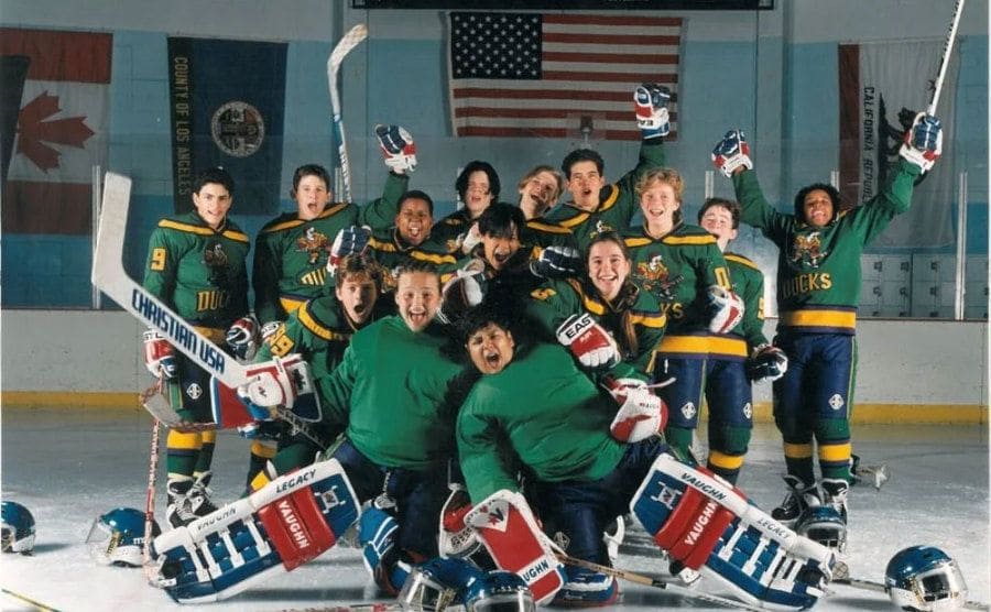 The actors who played The Mighty Ducks team takes a group picture on the ice. 