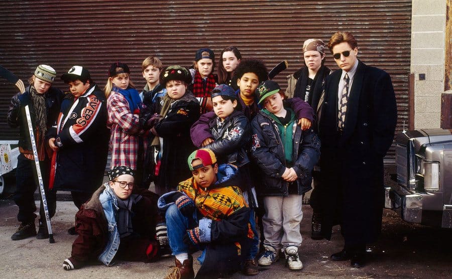 The cast of The Mighty Ducks poses in a group picture. 