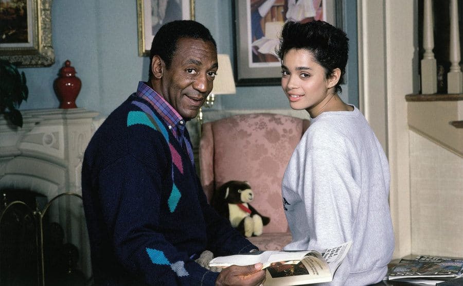Lisa Bonet and Bill Cosby going over the script on set. 