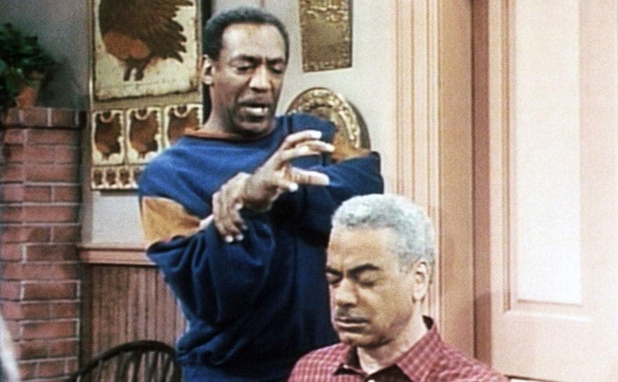 Bill Cosby pretending to try and hurt Earle Hyman, who plays his father on The Bill Cosby Show. 