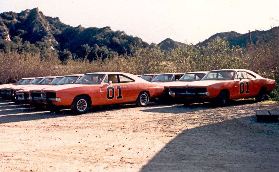 Rows of Dodge Charges in a shot behind the scenes of the television show. 