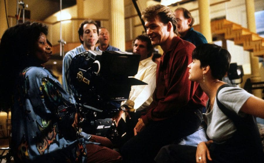 Actors Whoopi Goldberg, Patrick Swayze, Demi Moore, and director Jerry Zucker on the set of Ghost.