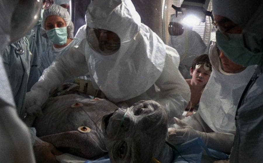 Doctors and nurses work on E.T. in a scene from the film. 