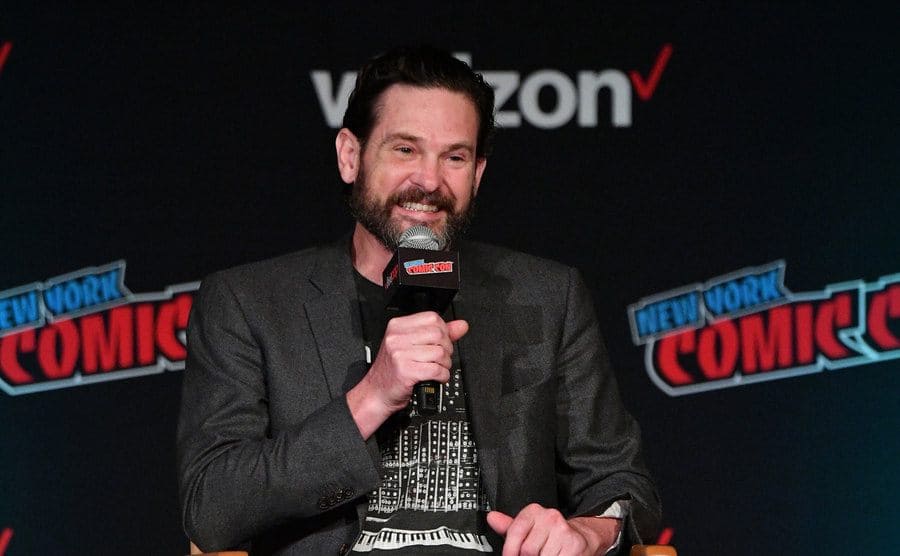 Henry Thomas speaks onstage at the Netflix & Chills panel. 
