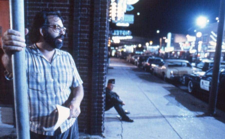 Coppola is standing on the set of his movie Rumble Fish.