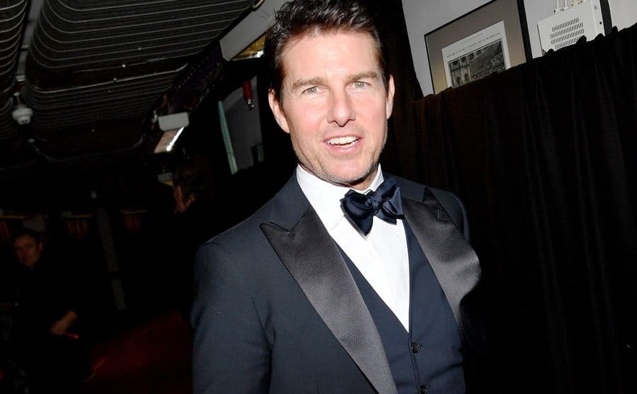 Tom Cruise poses backstage. 