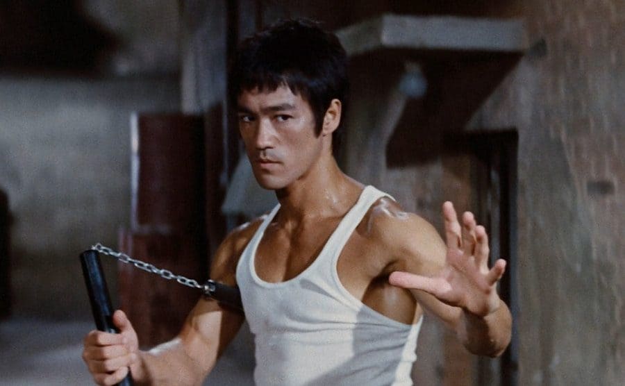 Bruce Lee waits, ready to fight in a publicity still from The Way of the Dragon.