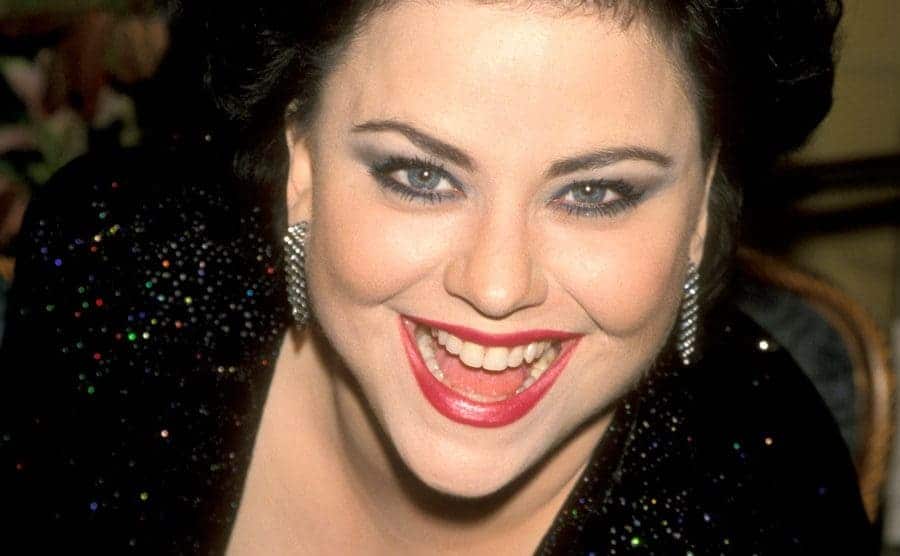 A portrait of Delta Burke smiling at the camera. 