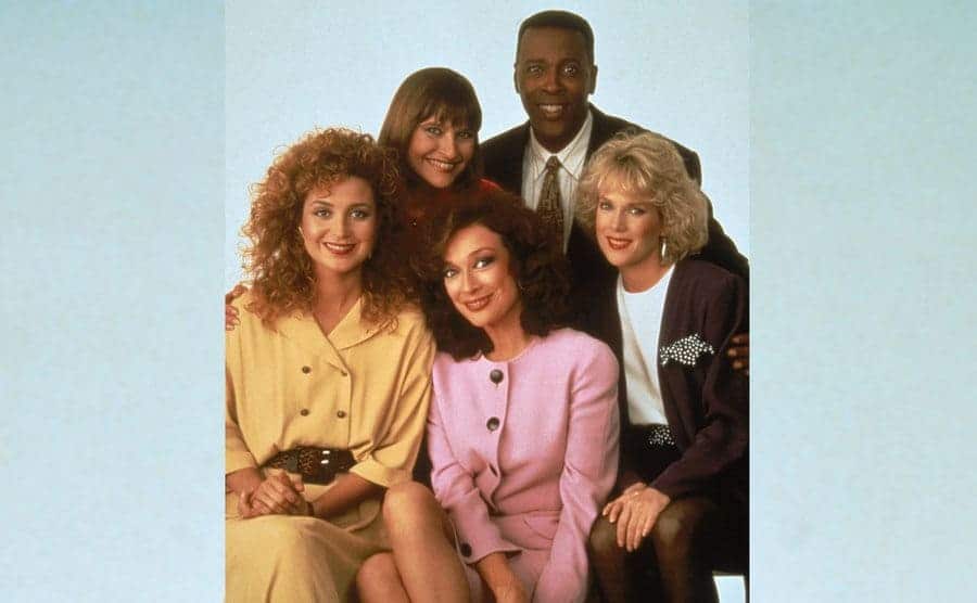 Annie Potts, Jan Hooks, Meshach Taylor, Julia Duffy, and Dixie Carter pose together.