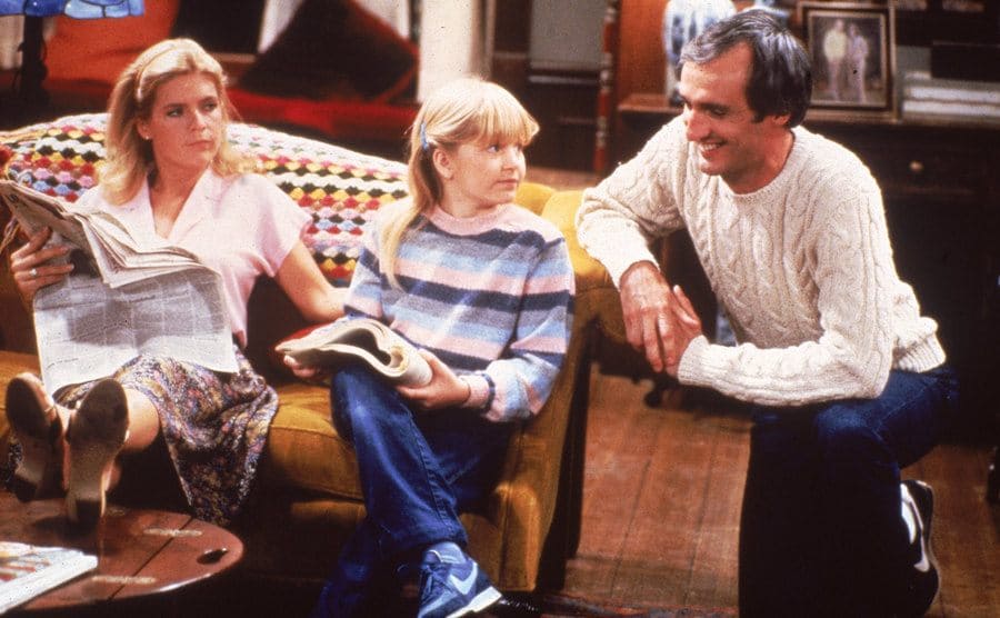 Meredith Baxter, Tina Yothers, and Michael Gross in a scene from sitcom. 