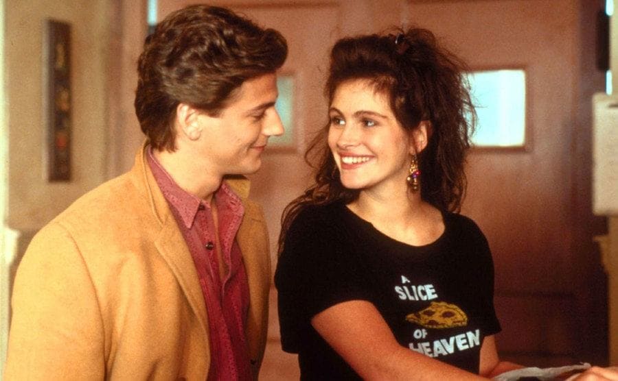 Roberts and Stroke, stare into each other’s eyes in a still from Mystic Pizza. 