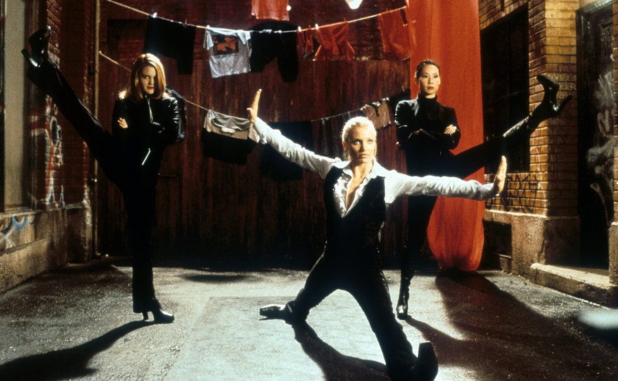 Drew Barrymore, Cameron Diaz, and Lucy Liu are pulling off karate poses. 