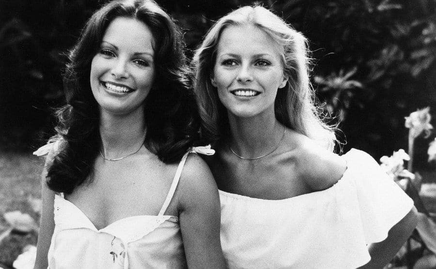 Cheryl Ladd is posing next to Jaclyn Smith on the set of the show. 
