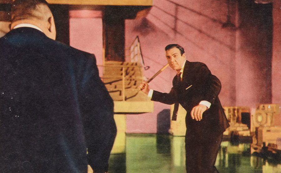 Sean Connery and Harold Sakata fighting each other in the film.