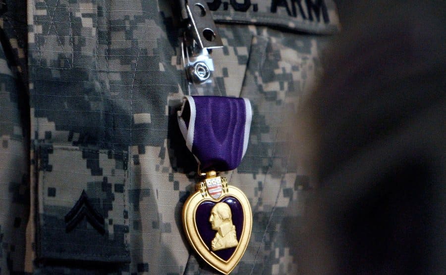 The Purple Heart medal in a US army uniform. 