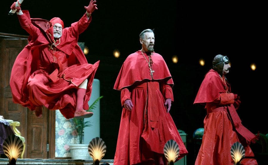 Gilliam, Palin, and Jones in The Spanish Inquisition sketch onstage. 