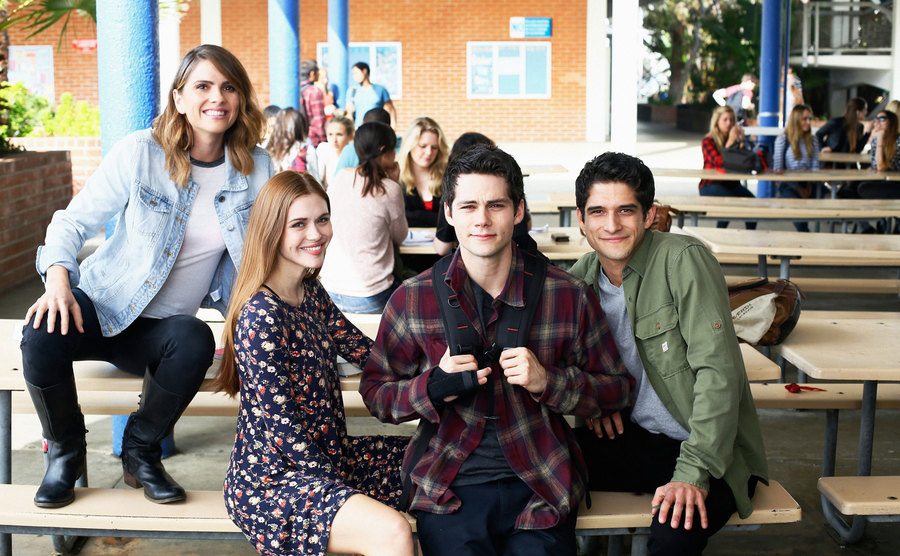Shelley Henning, Holland Roden, Dylan O’Brien and Tyler Posey sitting on a bench. 