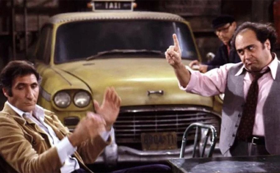 Danny DeVito and Judd Hirsch in a scene from Taxi. 