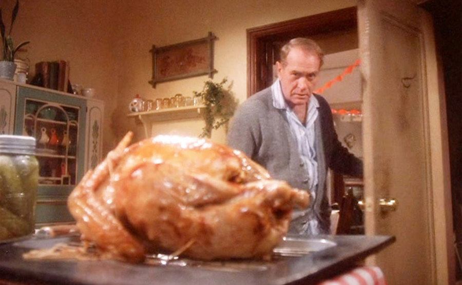 The Old Man walks into the kitchen and stares at the delicious turkey. 