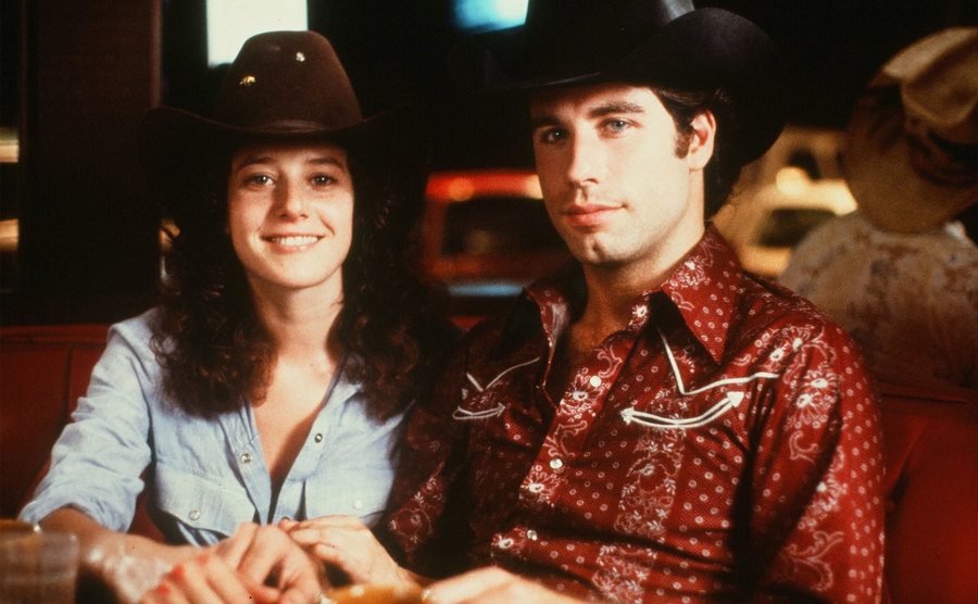 John Travolta and Debra Winger pose in a scene from 'Urban Cowboy