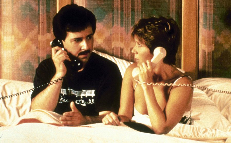 Carrie Fisher and Bruno Kirby talk on separate phones in a scene from the film. 