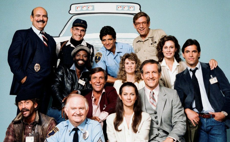 The cast of Hill Street Blues poses for a studio photoshoot. 