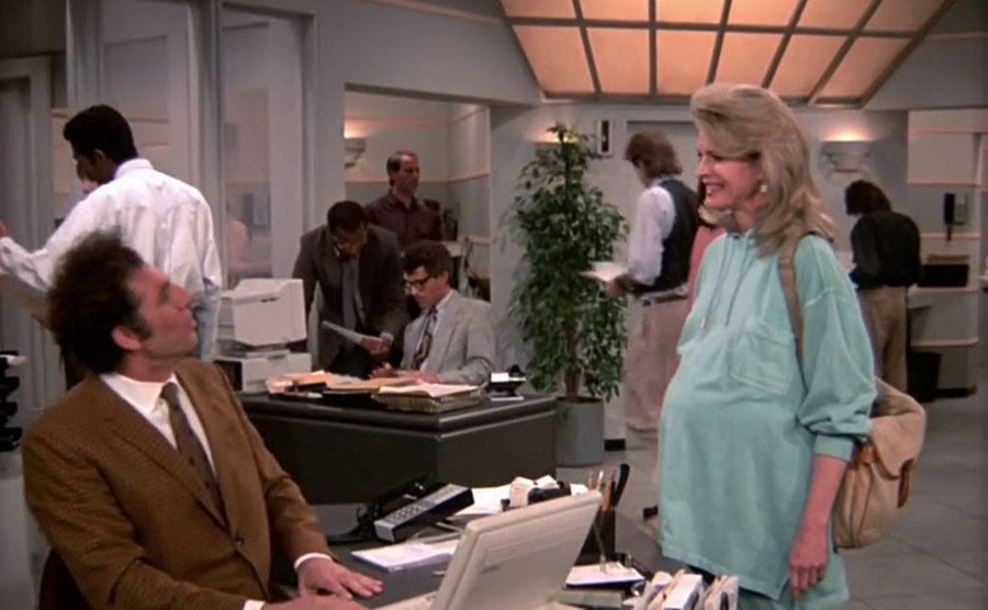 Murphy Brown talks to Kramer, who is working as a secretary. 