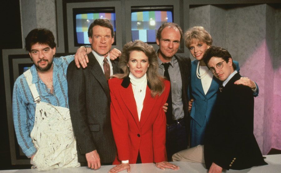 The cast of Murphy Brown poses on set. 