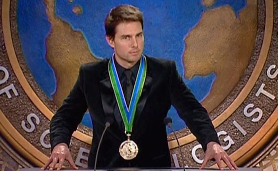 Tom Cruise receives an award from the Church of Scientology. 