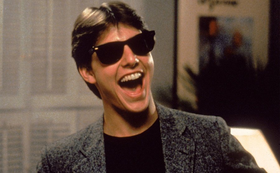 Tom Cruise with his Ray-Ban Wayfarers in a still from Risky Business. 