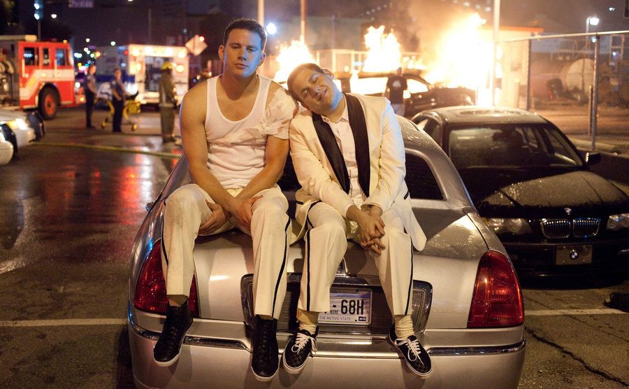 Tatum and Hill sit on the trunk of the limo in the final scene of 21 Jump Street. 