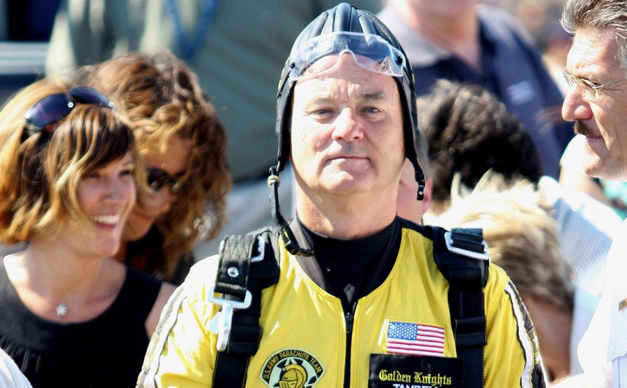 Bill Murray poses for photos upon completing his skydiving tandem.