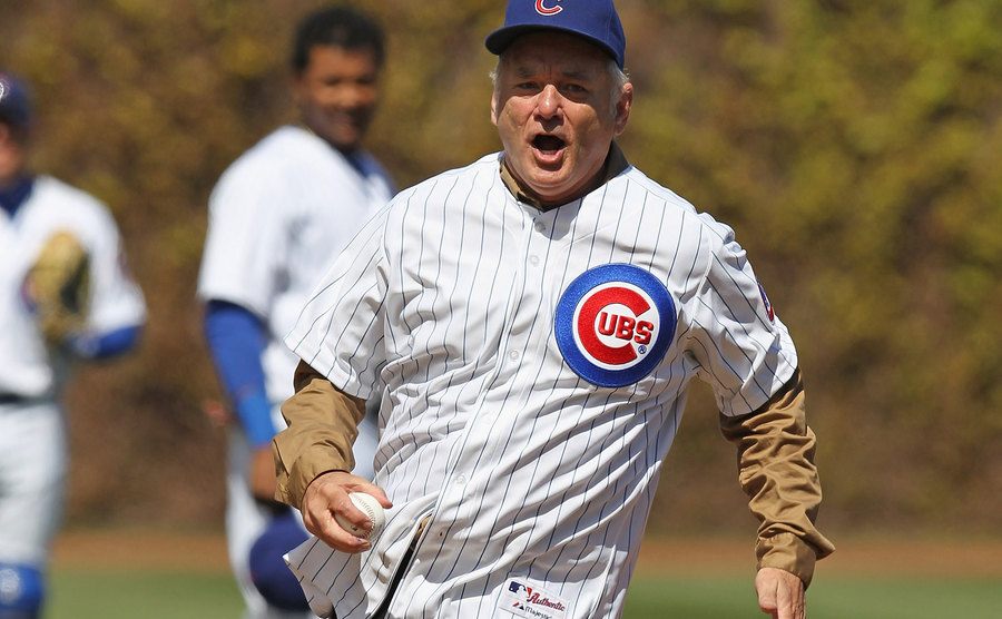 Bill Murray runs the bases in a baseball yard.
