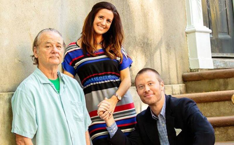 Bill Murray poses with the couple.