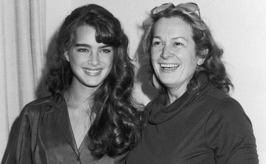 Brooke smiles while posing with her mother for a picture.