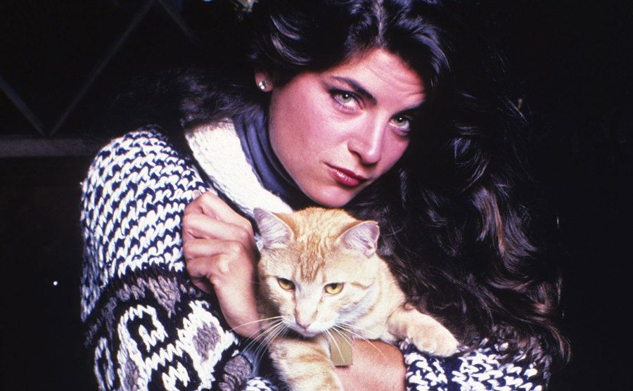 Kirstie Alley poses for a portrait holding her cat at home.