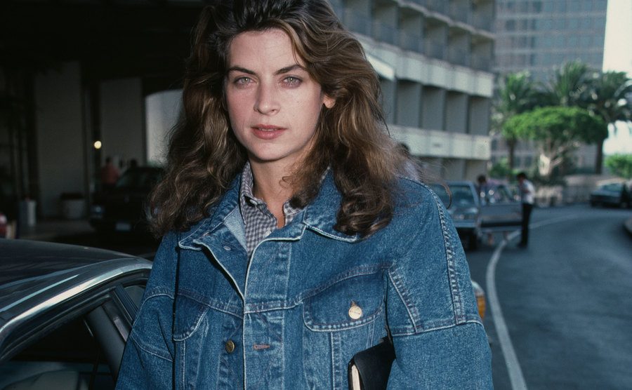 An urban photo of Kirstie Alley wearing a denim outfit.